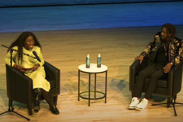 Yewande Pearse and  AZA Allsop seated in chairs, facing each other on stage